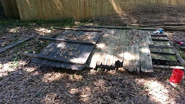 Backyard Fencing Old Panels Await Deconstruction