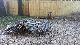 Backyard Fencing Old Panels Await Deconstruction