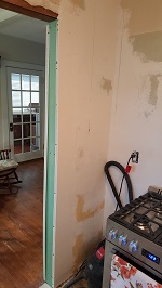 The New Drywall Extension Installed And First Coated Kitchen Side